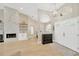 Inviting foyer with modern light fixture, leading into the bright and spacious living area at 4617 Basswood St, Land O Lakes, FL 34639