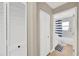 Hallway with access to the bathroom and built in storage cabinets at 4617 Basswood St, Land O Lakes, FL 34639