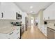 Well-appointed kitchen with stainless steel appliances, white cabinets, and plenty of countertop space at 4617 Basswood St, Land O Lakes, FL 34639