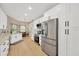 Modern kitchen featuring stainless steel appliances, white cabinets, and a view to the breakfast nook at 4617 Basswood St, Land O Lakes, FL 34639