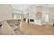 Open concept living room showcasing a modern fireplace and seamless indoor-outdoor flow at 4617 Basswood St, Land O Lakes, FL 34639