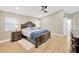 Spacious main bedroom with hardwood floors, ceiling fan, and elegant furnishings at 4617 Basswood St, Land O Lakes, FL 34639