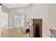 Bedroom with neutral wall color, recliner, and natural light from sliding glass doors at 4617 Basswood St, Land O Lakes, FL 34639