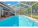 Gorgeous pool area with an enclosed patio and views of the community at 4617 Basswood St, Land O Lakes, FL 34639