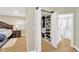 Custom walk-in closet with ample shelving and storage, adjacent to bedroom and bathroom at 4617 Basswood St, Land O Lakes, FL 34639
