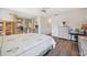 Bedroom with wood flooring, ceiling fan, dresser, and sliding glass doors at 4712 Coachmen Rd, New Port Richey, FL 34655