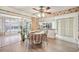 Bright dining area with sliding glass doors and a view of the outdoor space at 4712 Coachmen Rd, New Port Richey, FL 34655