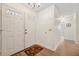 Bright entryway features double doors, wood flooring, and access to other rooms at 4712 Coachmen Rd, New Port Richey, FL 34655