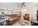 Open living space with ceiling fan, and a view leading to the front entryway at 4712 Coachmen Rd, New Port Richey, FL 34655