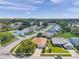 Aerial view of a quiet residential street with mature landscaping and charming homes at 4712 Coachmen Rd, New Port Richey, FL 34655
