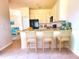 Modern kitchen with breakfast bar and ample counter space at 4950 Sandy Brook Cir, Wimauma, FL 33598