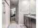 Bathroom featuring a shower and dark wood vanity with granite counters at 5522 Appleton Shore Dr, Apollo Beach, FL 33572