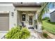 Inviting front porch featuring decorative plants, creating a cozy entrance to the home at 5522 Appleton Shore Dr, Apollo Beach, FL 33572