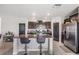 Modern kitchen with granite counters, stainless steel appliances, and an island with bar seating at 5522 Appleton Shore Dr, Apollo Beach, FL 33572