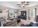 Comfortable living room featuring ample seating, a flat-screen TV, and bright windows for a cozy feel at 5522 Appleton Shore Dr, Apollo Beach, FL 33572