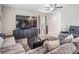 Cozy living room featuring a large TV, plush seating, and stylish decor for a relaxed atmosphere at 5522 Appleton Shore Dr, Apollo Beach, FL 33572
