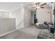 Cozy upstairs loft area featuring carpet floors, ceiling fan, and neutral paint at 5522 Appleton Shore Dr, Apollo Beach, FL 33572