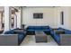 Inviting outdoor lounge with plush seating, a TV, and a relaxing ambiance at 5522 Appleton Shore Dr, Apollo Beach, FL 33572