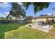 Lush backyard with an above-ground pool, patio seating, and barbecue grill at 5632 62Nd N St, St Petersburg, FL 33709