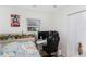 Bright bedroom with a window, a fun theme, and a desk setup for gaming or working at 5632 62Nd N St, St Petersburg, FL 33709