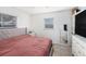 Cozy bedroom featuring natural light, neutral color scheme, and tiled floors at 5632 62Nd N St, St Petersburg, FL 33709