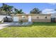 Charming single-story home featuring a manicured lawn and a welcoming front entrance at 5632 62Nd N St, St Petersburg, FL 33709