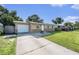 Well-kept single-story home with an attached garage and lush front lawn at 5632 62Nd N St, St Petersburg, FL 33709
