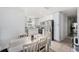 Modern kitchen with white cabinets, stainless steel appliances, and tile flooring at 5632 62Nd N St, St Petersburg, FL 33709