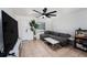Cozy living room featuring tile floors, a large sectional, and a bright window at 5632 62Nd N St, St Petersburg, FL 33709