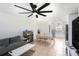 Open-concept living space with tile floors, opening to the kitchen and dining area at 5632 62Nd N St, St Petersburg, FL 33709