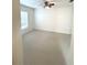 Bright bedroom with large window and ceiling fan, perfect for relaxation and rest at 5644 Samter Ct, Tampa, FL 33611