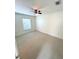 Spacious bedroom illuminated by natural light and featuring a ceiling fan for comfort at 5644 Samter Ct, Tampa, FL 33611