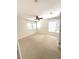 This bedroom features neutral carpet, a ceiling fan and two windows with blinds at 5644 Samter Ct, Tampa, FL 33611
