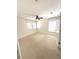 This bedroom features neutral carpet, a ceiling fan and two windows with blinds at 5644 Samter Ct, Tampa, FL 33611