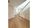 Foyer with staircase and wood laminate flooring leading to the front door at 5644 Samter Ct, Tampa, FL 33611
