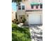 Charming two-story home with well-manicured lawn and attached garage at 5644 Samter Ct, Tampa, FL 33611