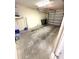 Spacious two car garage with white brick walls at 5644 Samter Ct, Tampa, FL 33611