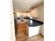 Well-lit kitchen features white cabinets, stainless steel appliances, and modern fixtures at 5644 Samter Ct, Tampa, FL 33611