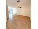 Expansive living room with ceiling fan and sliding glass doors to the backyard at 5644 Samter Ct, Tampa, FL 33611