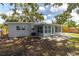 Backyard featuring a concrete patio, a fence, and mature trees, perfect for outdoor entertaining at 6334 22Nd N Ave, St Petersburg, FL 33710