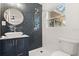Modern bathroom featuring a vessel sink, decorative tile, and a glass shower with a rainfall shower head at 6334 22Nd N Ave, St Petersburg, FL 33710