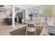 Bright dining area with modern table set next to the kitchen and many windows for natural light at 6334 22Nd N Ave, St Petersburg, FL 33710