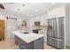 Modern kitchen with white cabinets, stainless steel appliances, and a large island at 6334 22Nd N Ave, St Petersburg, FL 33710