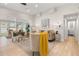 Bright living room featuring neutral decor, modern lighting, and view into sunroom at 6334 22Nd N Ave, St Petersburg, FL 33710