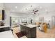 Open-concept living space with sleek island and view into cozy living room at 6334 22Nd N Ave, St Petersburg, FL 33710