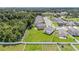 Aerial view of home showing expansive backyard, privacy fence and community at 6347 Ten Acre Ct, Zephyrhills, FL 33541