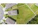 Aerial view of the home displaying a large, well-maintained backyard at 6347 Ten Acre Ct, Zephyrhills, FL 33541