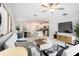 Open-concept living room with modern decor, contemporary furnishings, and tile flooring at 6347 Ten Acre Ct, Zephyrhills, FL 33541