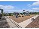 Community playground featuring slides, climbing structures, and a mulch ground cover at 6347 Ten Acre Ct, Zephyrhills, FL 33541