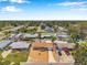An aerial view shows the home's proximity to tree coverage, neighborhood streets, and well-maintained landscaping at 6352 Canton S St, St Petersburg, FL 33712